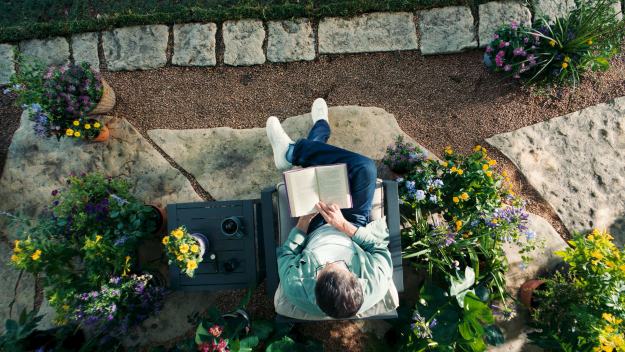 Woman sitting with a book on her lap.